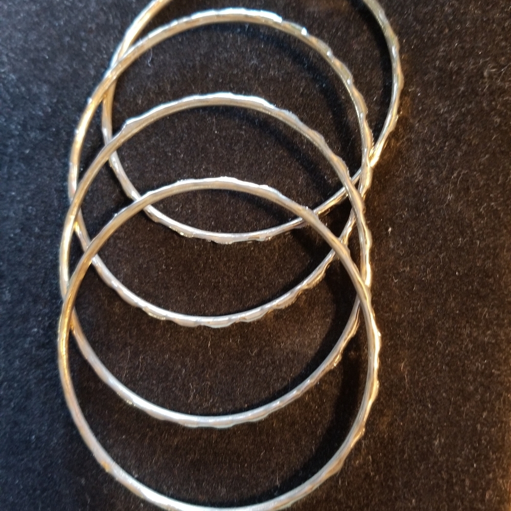 4 piece slip-on gold tone bangle bracelet.